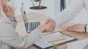 personal injury lawyer shaking the hand of a client explaining to them what happens after your lawyer sends a demand letter