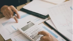 person calculating deductible expenses for a personal injury lawsuit